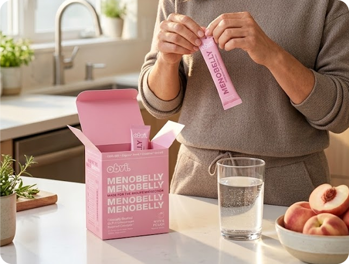 Woman opening a Menobelly stick pack in a kitchen