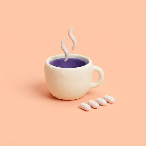 One coffee cup beside four capsules